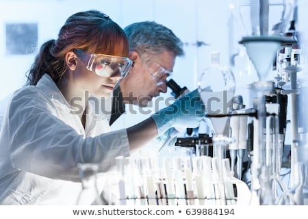 Stockfoto: Senior Scientist Microscoping In Lab