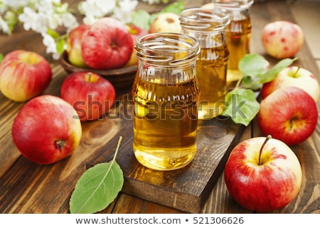 Stok fotoğraf: Apple Juice In The Jug With Glass On Wooden Table