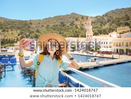 ストックフォト: Excited Female Tourist Making Self Portrait In Front Of The Waterfall Woman Having A Great Vacation