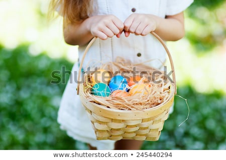Stockfoto: Close Up Of Colored Easter Eggs In Basket