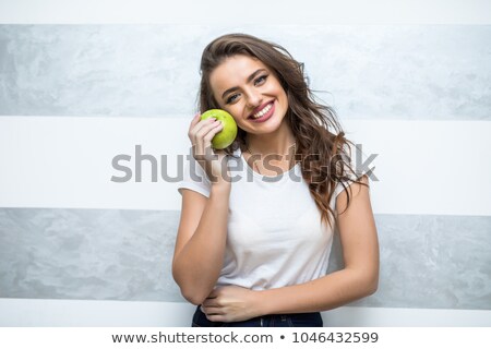 Stok fotoğraf: Bed Of A Beautiful Blond Woman Holding Apple