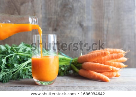 Foto stock: Carrot Vegetable Juice In Glass Jug