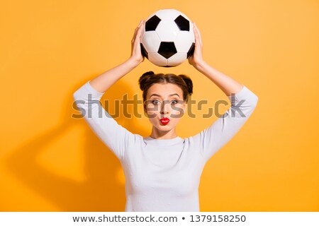ストックフォト: Young Girl Wearing Leather Football On Head
