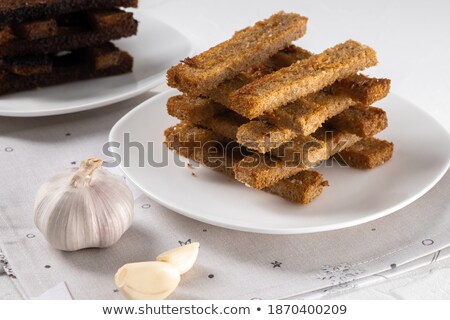 Stockfoto: Fried Bread And Cloves Of Fresh Garlic