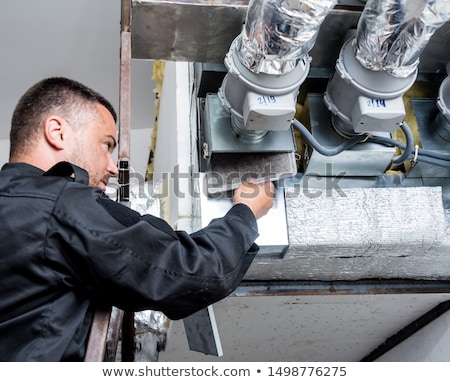 Stockfoto: Ventilation Cleaner Working On A Air System