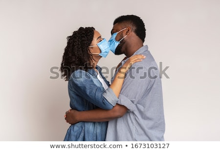 Сток-фото: Loving African American Couple Hugging Wearing Medical Face Mask