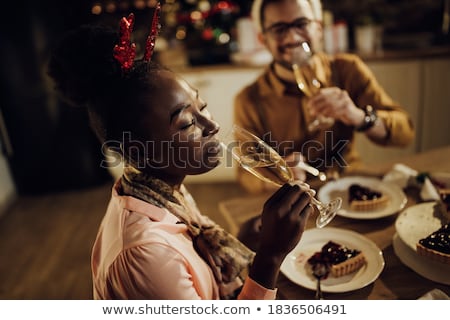 Сток-фото: Young Woman Drinking Champagne With Her Boyfriend At Christmas