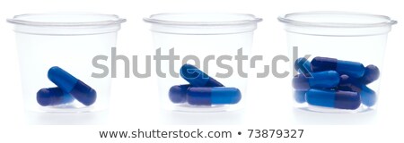 Zdjęcia stock: Three Containers With Different Amount Of Pills