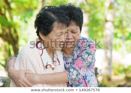 Mature Woman Consoling Her Crying Old Mother Foto d'archivio © szefei