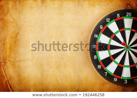 Сток-фото: Vintage Dart Board On Dark Wall Grunge