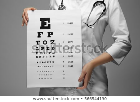 Zdjęcia stock: Young Woman Ophthalmologist With Eye Chart