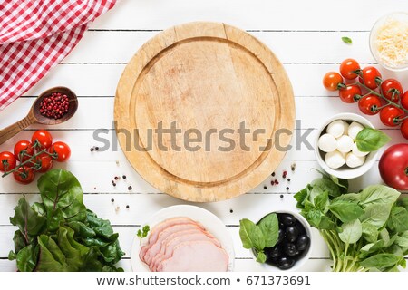 Foto d'archivio: Bread Homemade With Ingredients Spices And Green Basil On Wooden Background Top View