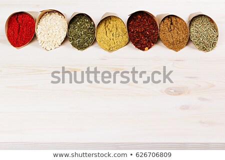 Foto stock: Assortment Of Varied Powder Spices Close Up On White Wooden Board As Decorative Border With Copy