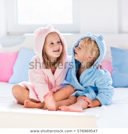 Foto d'archivio: Boy And Girl On Bed