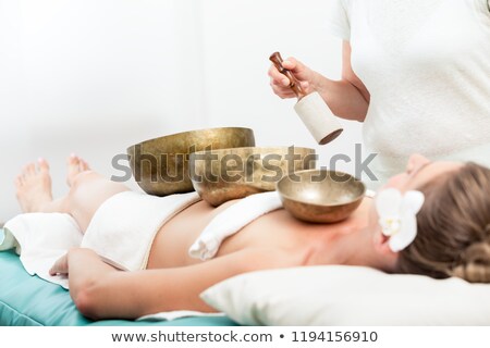 Foto stock: Woman Receiving Singing Bell Sound Therapy