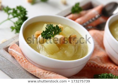 Foto stock: Creamy Sweet Potato Soup With Croutons And Parsley In White Bowl