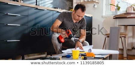 Foto stock: Man Repairing Furniture At Home