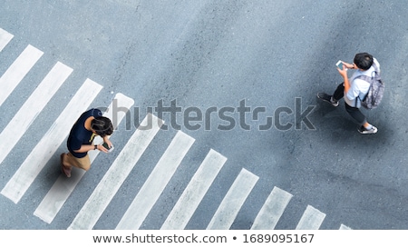 Stockfoto: People Walking With Smartphone On The Road