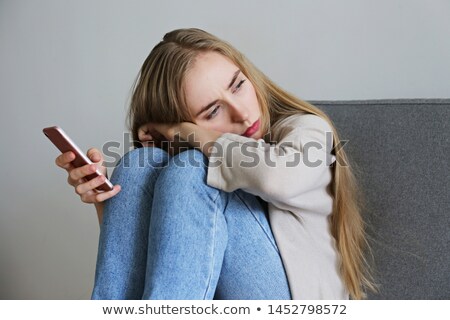 Foto stock: Lonely Woman Sitting On Sofa