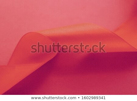 Stockfoto: Abstract Curly Silk Ribbon On Rose Background Exclusive Luxury