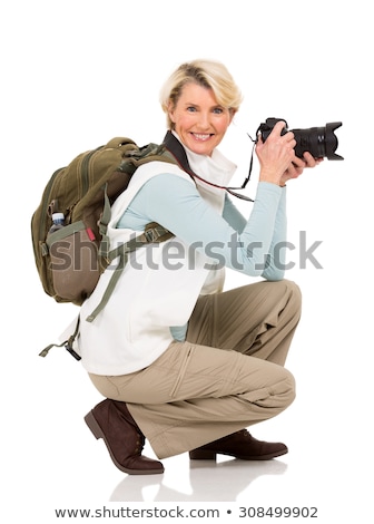 Foto d'archivio: The Aged Female Tourist Isolated On White