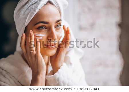 Stok fotoğraf: Woman Putting On Cream