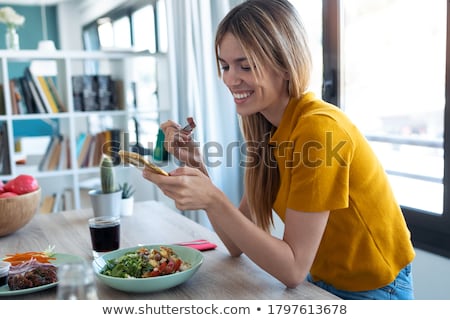 Stock photo: Woman Chatting On Her Mobile Phone