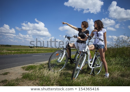 Two Pretty Girls On Bike Tour Zdjęcia stock © BrunoWeltmann