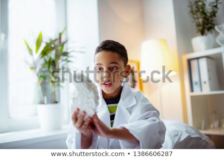 Foto stock: Curious Little Boy At Doctors Office