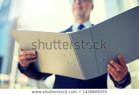 Stock photo: Senior Businessman With Ring Binder Folder In City