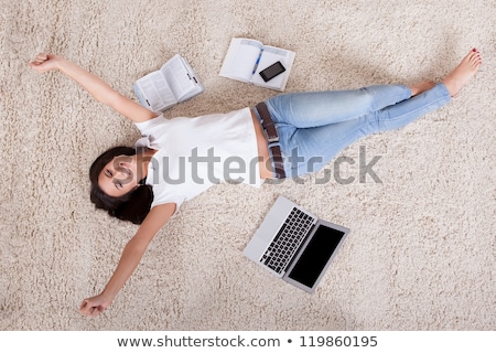 Stock fotó: Beautiful Woman Lying Works On The Carpet