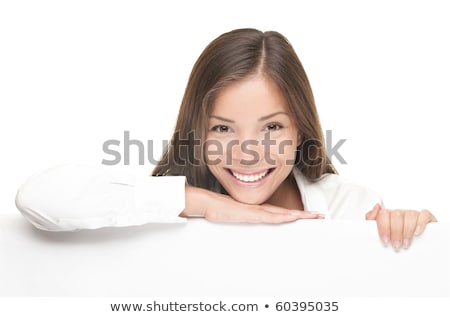 Foto stock: Woman Smiling Showing White Blank Sign Billboard