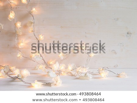 Stock photo: Christmas Soft Home Craft Decorations And Burning Lights On A Wood White Background