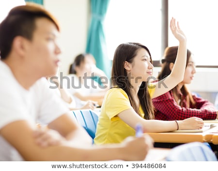 Stok fotoğraf: Smiling Teenage Girl With Raised Hands