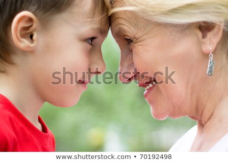 Mother And Grandmother With Children In A Park Stockfoto © privilege