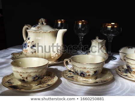 Stock photo: Set Of Rimmed Plates Bowls And Glasses