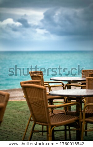 Foto d'archivio: Beach Chair Near The Ocean With Toys