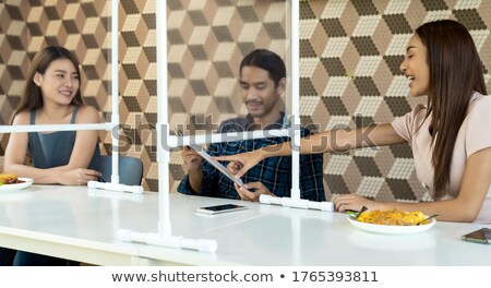 Stock photo: Asian Adult Eating Out Together At New Normal Restaurant