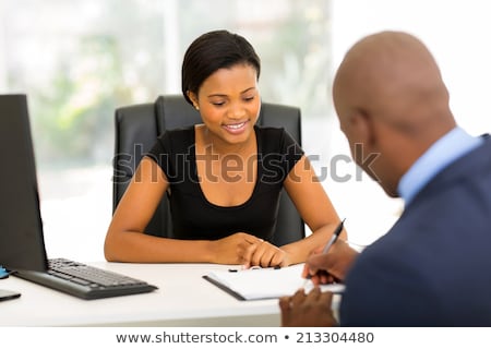 Foto stock: Beautiful Black Business Woman Signing Document