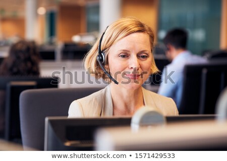 Stock foto: Woman Wearing A Telephone Headset