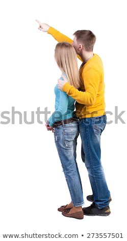 Foto stock: Woman Pointing At Something Interesting To Her Side