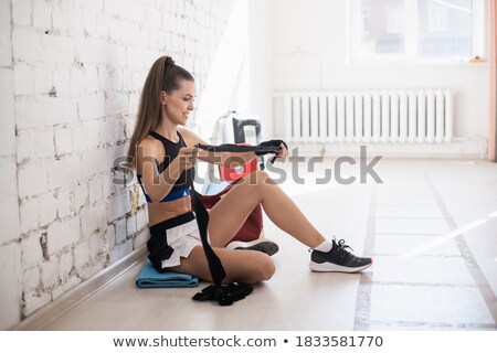 Stock photo: Strong Girls Body With With Elastic Bandage On Hand