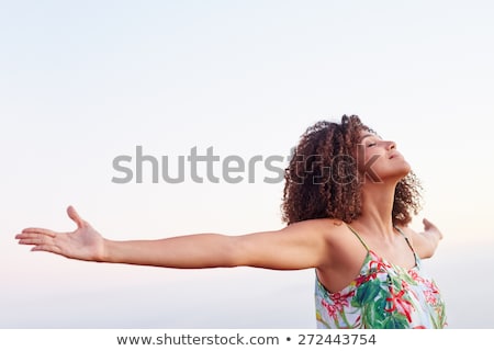 Stock fotó: Serene Young Woman Expressing Freedom In Nature