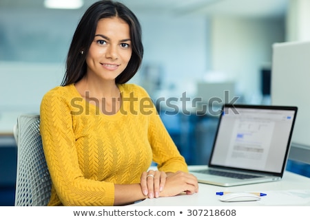 Stockfoto: Business Woman Thinking At Her Desk