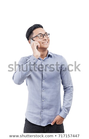 Stok fotoğraf: Young Asian Man Wearing Glasses Talking By Mobile Phone