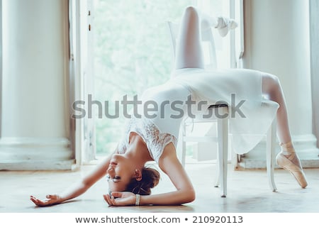 Stock photo: Blonde Ballerina Lies In Studio