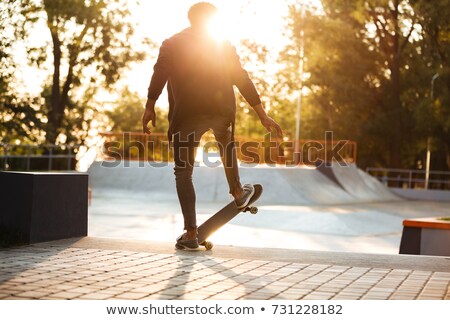 Zdjęcia stock: African Skateboarder Skating On A Concrete Skateboarding Ramp