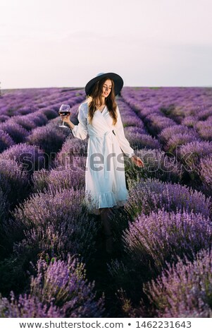 ストックフォト: Young Woman Standing In Meadows