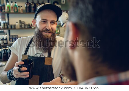 商業照片: Dedicated Hairstylist Drinking Coffee With His Customer And Friend