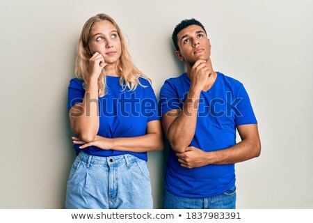 Сток-фото: Portrait Of A Smiling Pensive Multiethnic Couple